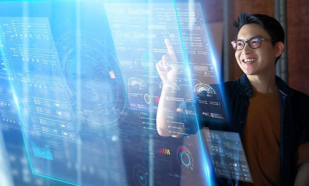 Administrator pointing at a translucent holographic dashboard