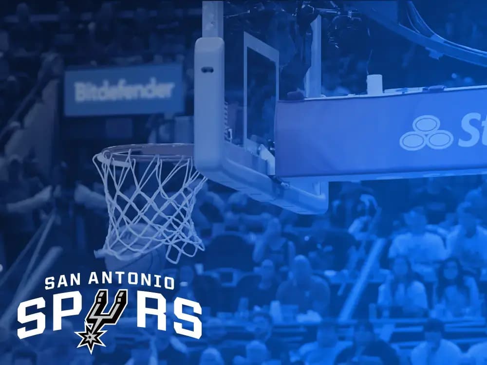 Basketball hoop at a San Antonio Spurs home game with Bitdefender courtside signage